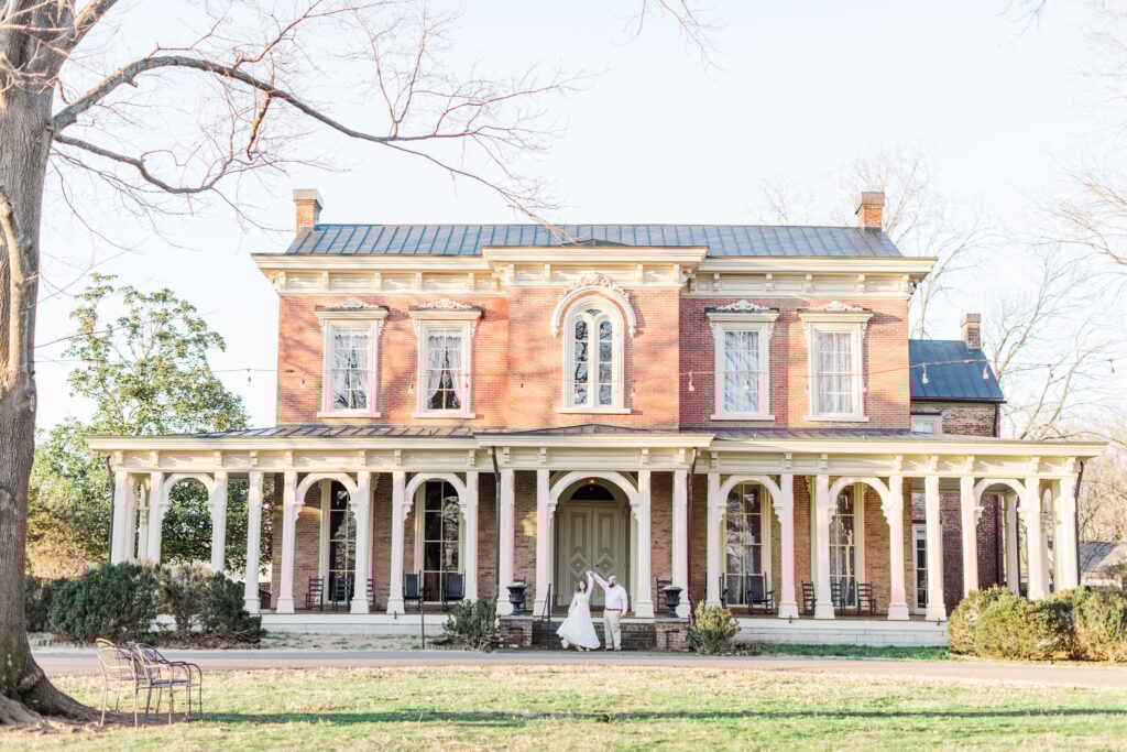 engaged couple spinning out front of Oaklands Mansion in Murfreesboro, TN