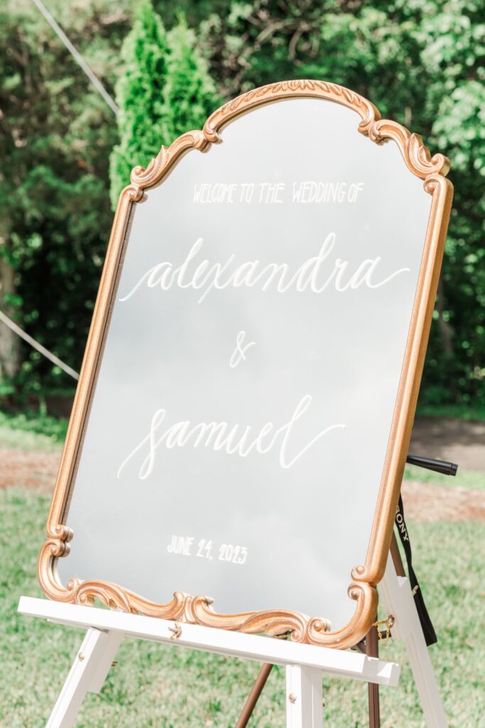 Wedding Ceremony Sign with green trees in the background