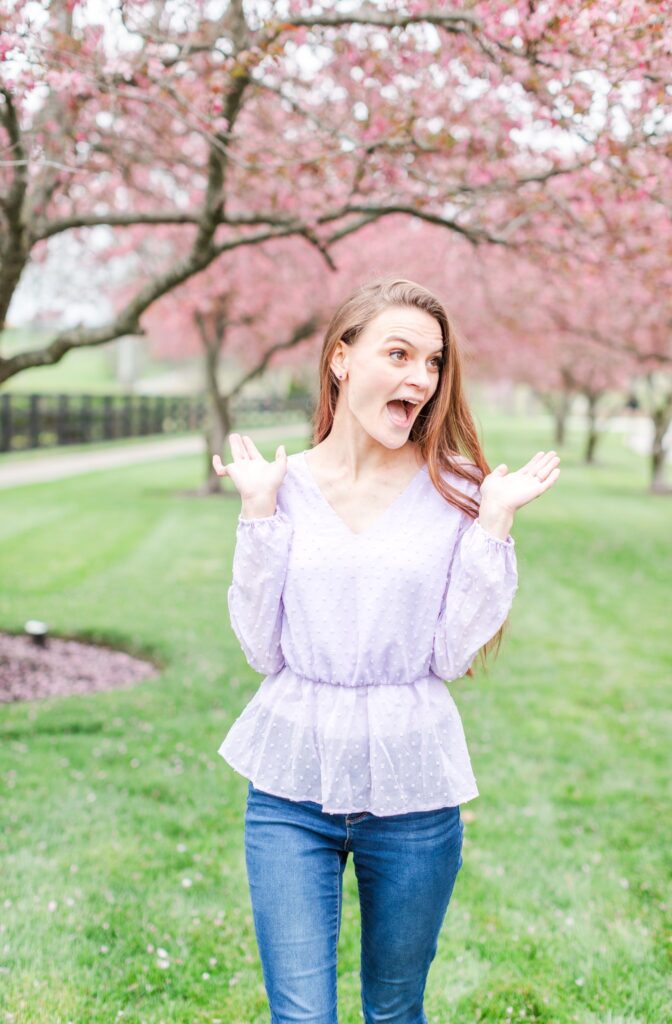 Jennifer Cooke, wedding photographer in an Eastern redbud patch gets excited about using HoneyBook!