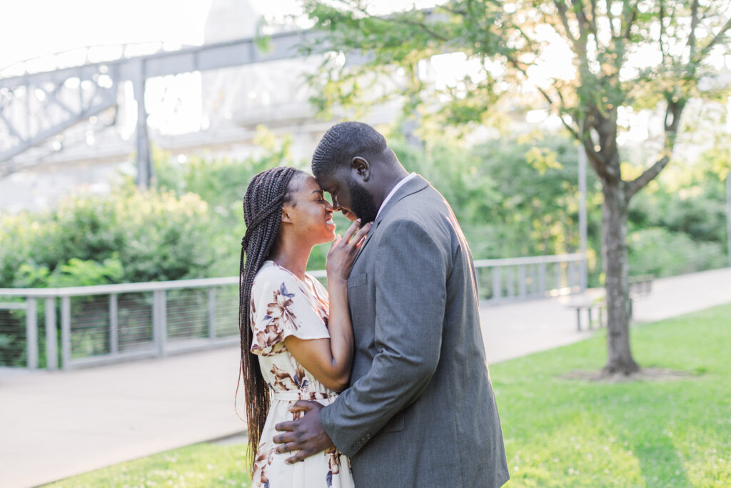 Engaged couple going forehead to forehead at their Cumberland Park Engagement Session in Nashville. 