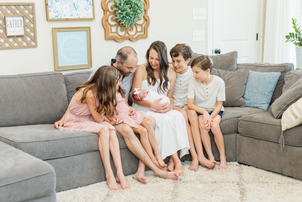 Franklin, TN family sitting on their living room couch, family outfit picture ideas