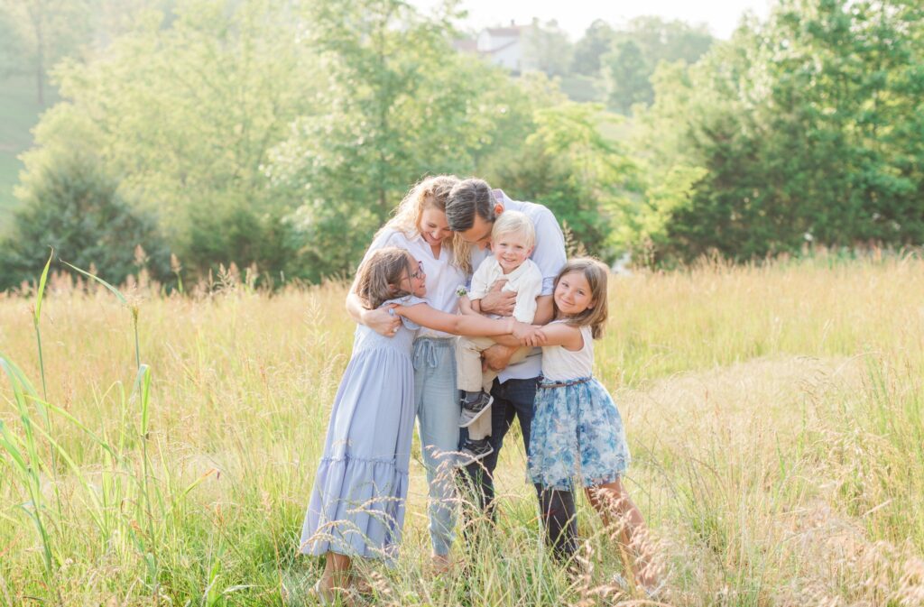 family in a bright, summer field, Hire the right family photographer