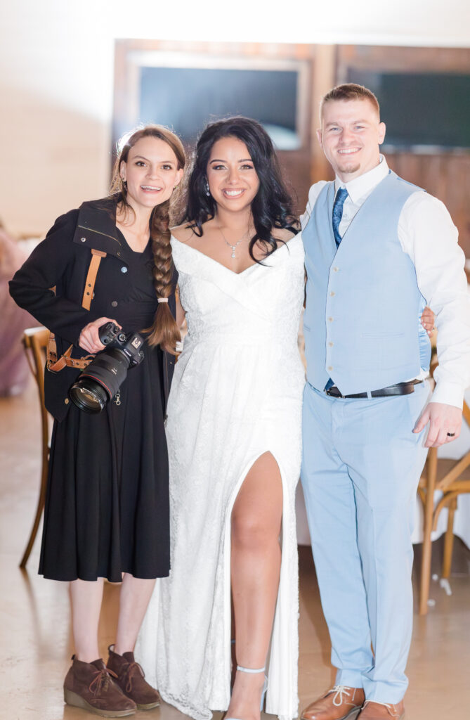 Jennifer Cooke smiling for a photo with one of her JC Couples on their wedding day! 