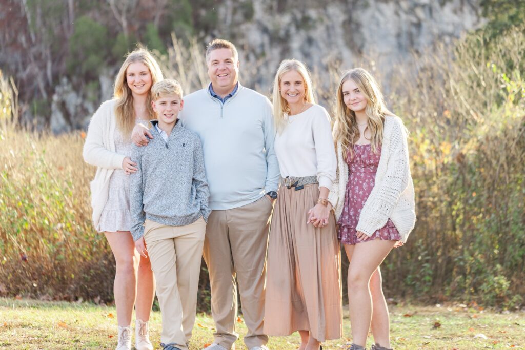 Beautiful family at a park wearing stunning outfits