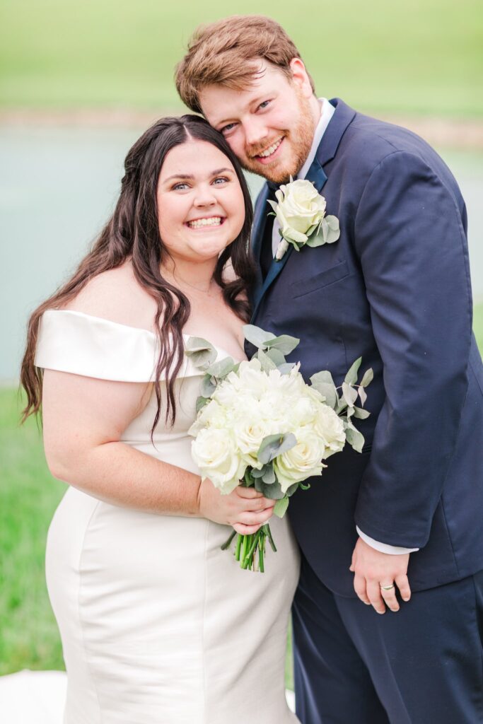 bride and groom smiling on their White Dove Barn wedding day