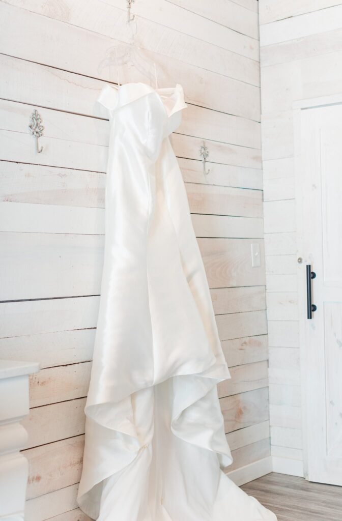 White, elegant wedding dress hanging in the Bridal Suite at the White Dove Barn in Tennessee