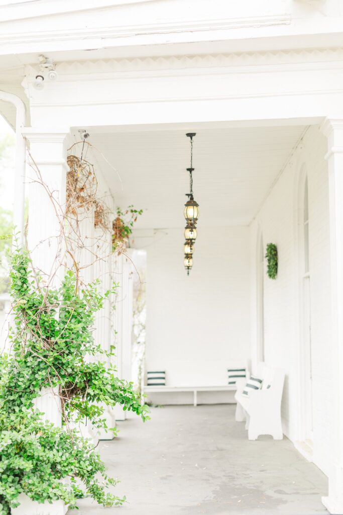 an artsy looking porch with pretty greenery! 