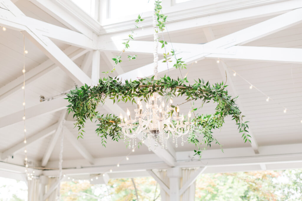 Beautiful chandelier with greenery installed at CJ's Off the Square