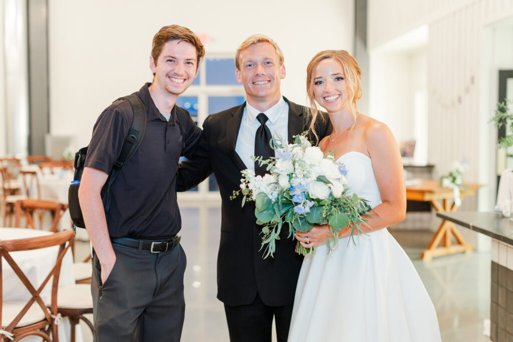 Kayla and Bailey with Daniel, their wedding photographer