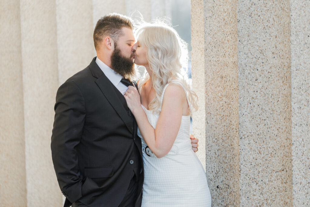 cute couple kissing at their luxurious Nashville Parthenon Engagement