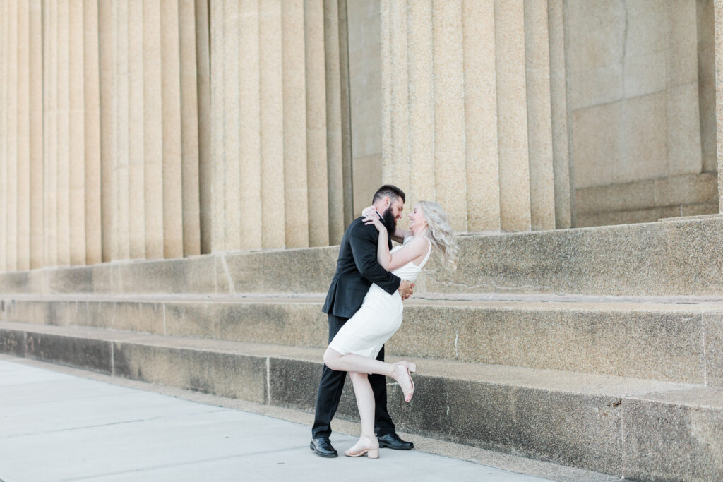 couple spinning at their luxurious Nashville Parthenon Engagement Session