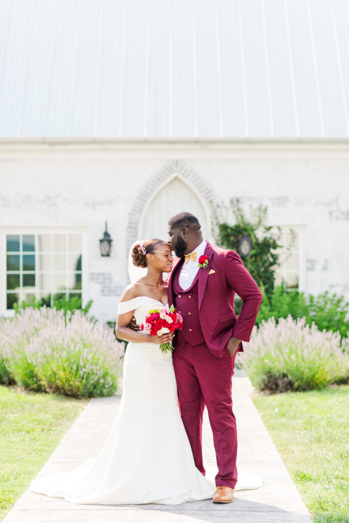 married couple at Howe Farms posing by the lavender