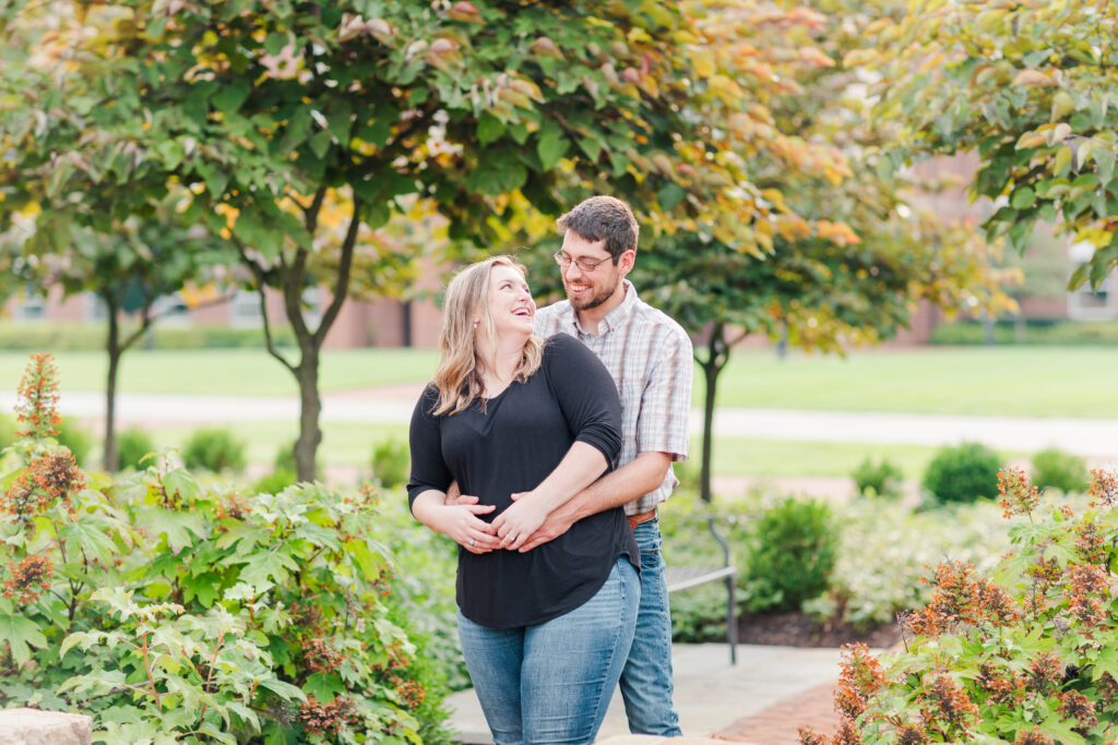 engaged couple at Liberty University laughing at each other